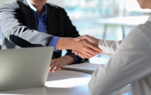 cropped shot of executives join hands to congratul 2021 08 27 17 56 53 utc